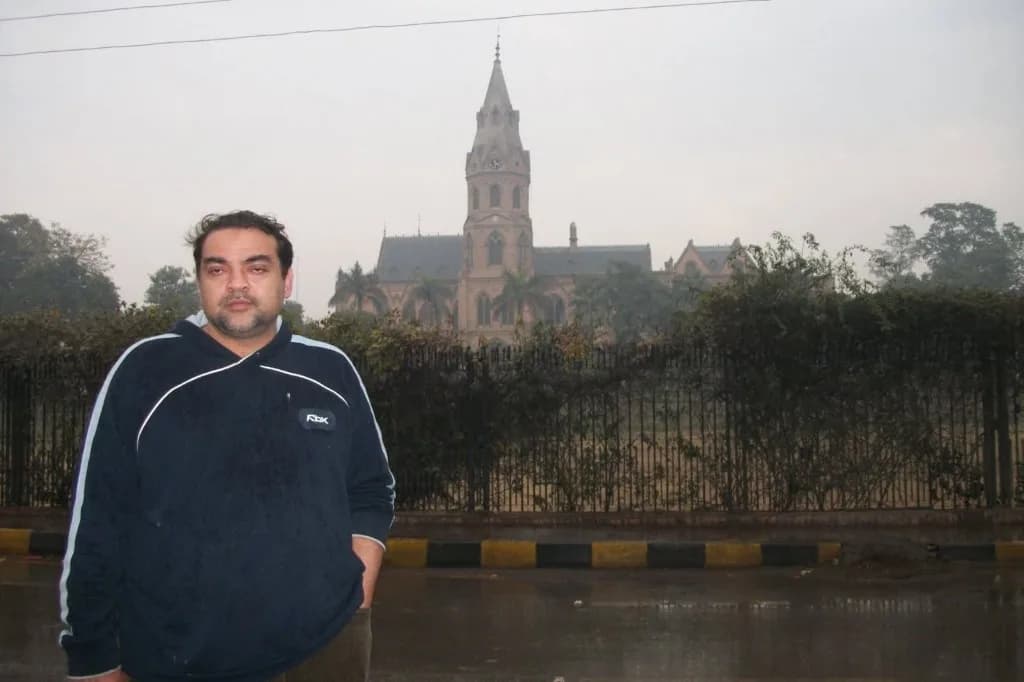 Historic gothic building with a clock spire seen during international business travel