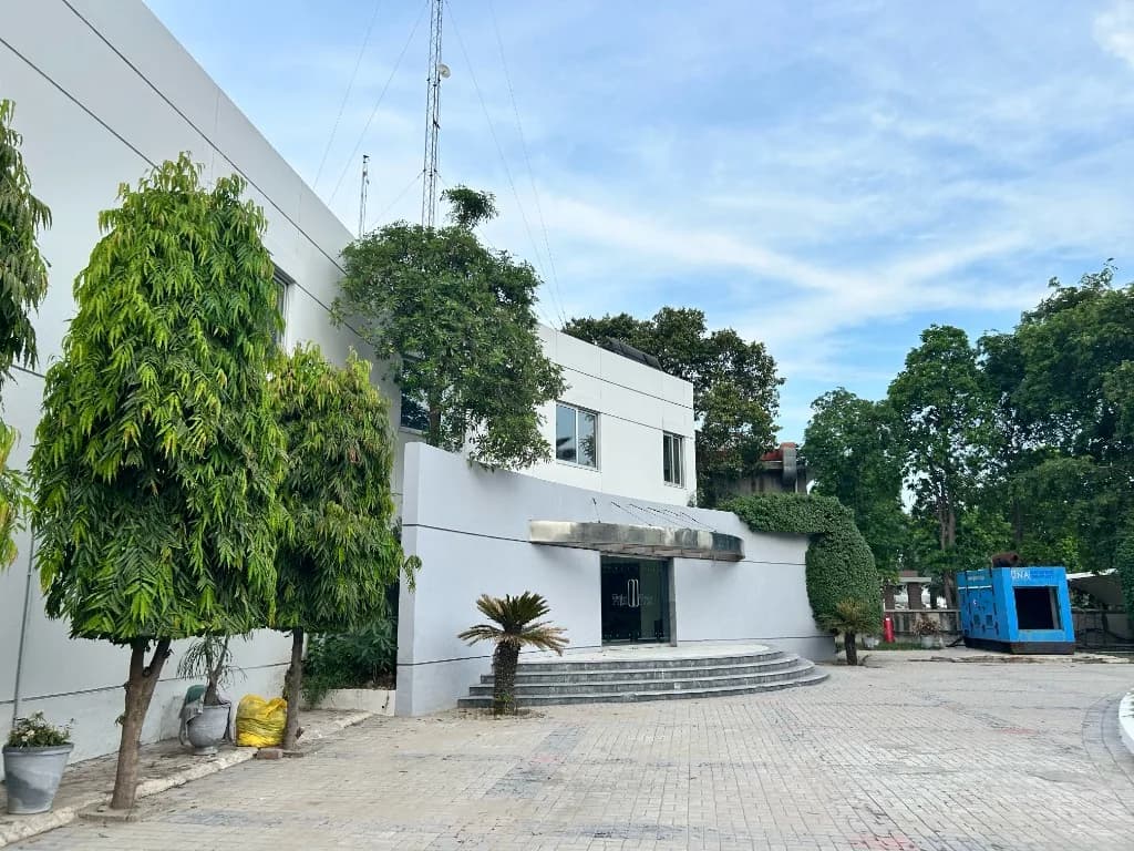 Wide view of the Prix Pharmaceutica facility entrance and paved forecourt