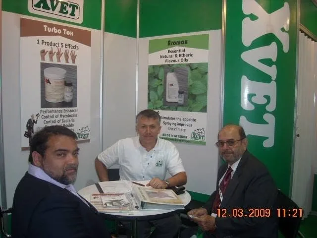 Technical discussion at the XVET exhibition booth during a veterinary trade event in March 2009