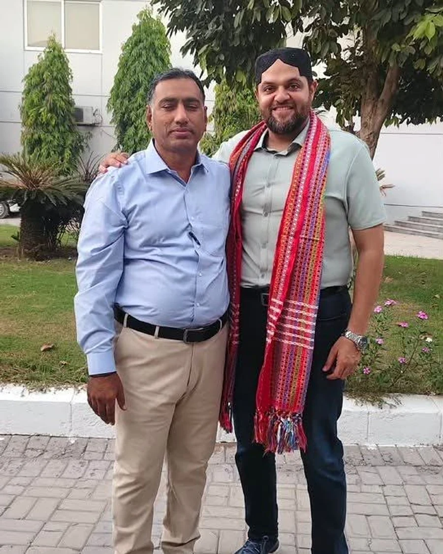 Participants wearing traditional Sindhi Ajrak during the Prix Pharmaceutica Sukkur Zone gathering