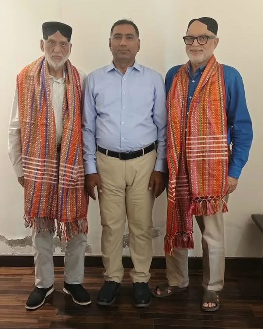 Participants wearing traditional Sindhi gifts during the Prix Pharmaceutica Sukkur Zone gathering
