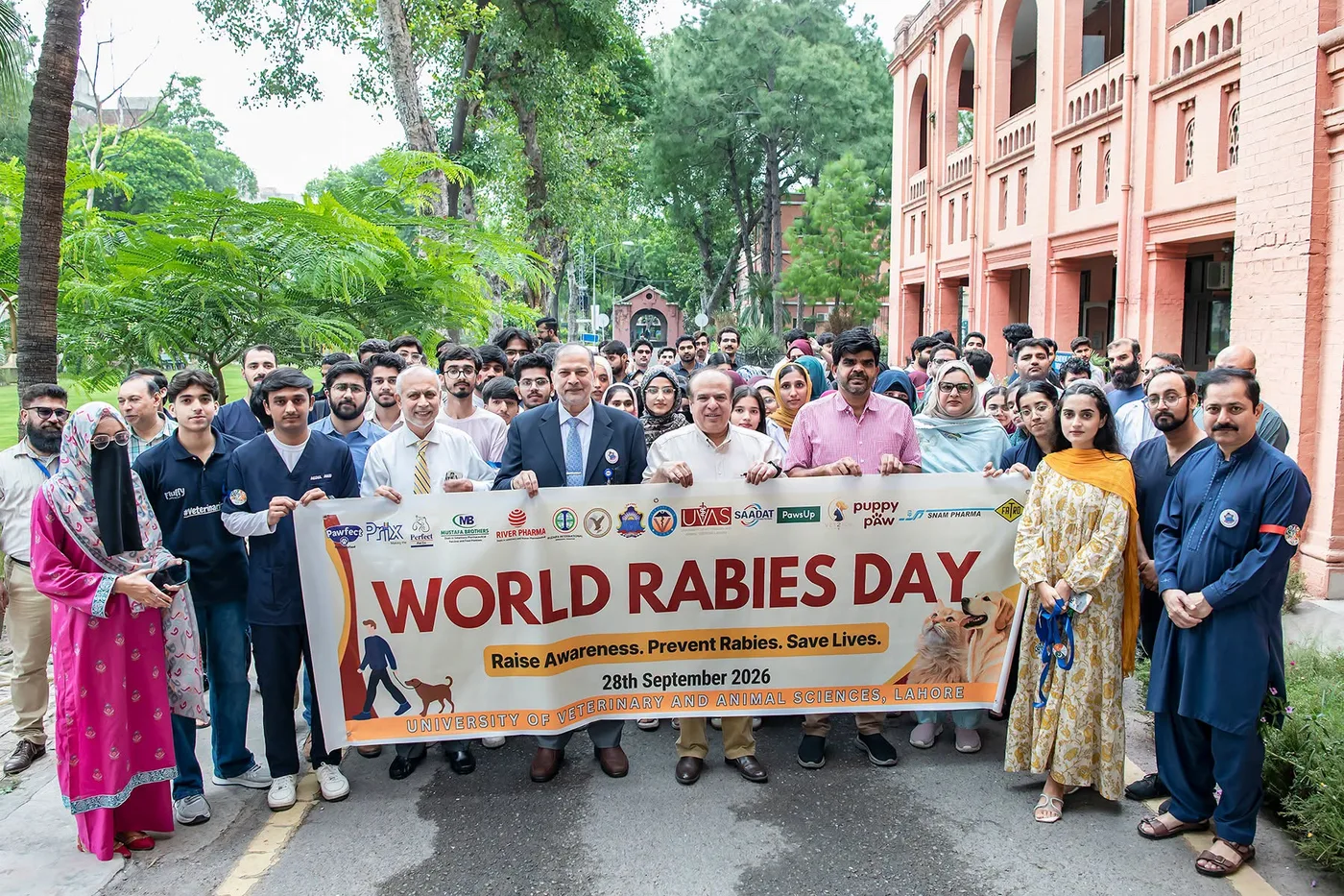 Group photograph from the World Rabies Day awareness walk at UVAS Lahore