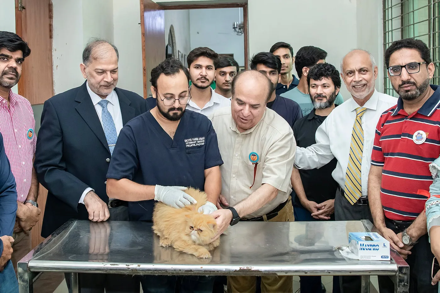 Veterinary team with a companion animal during the free rabies vaccination camp at UVAS Pet Center
