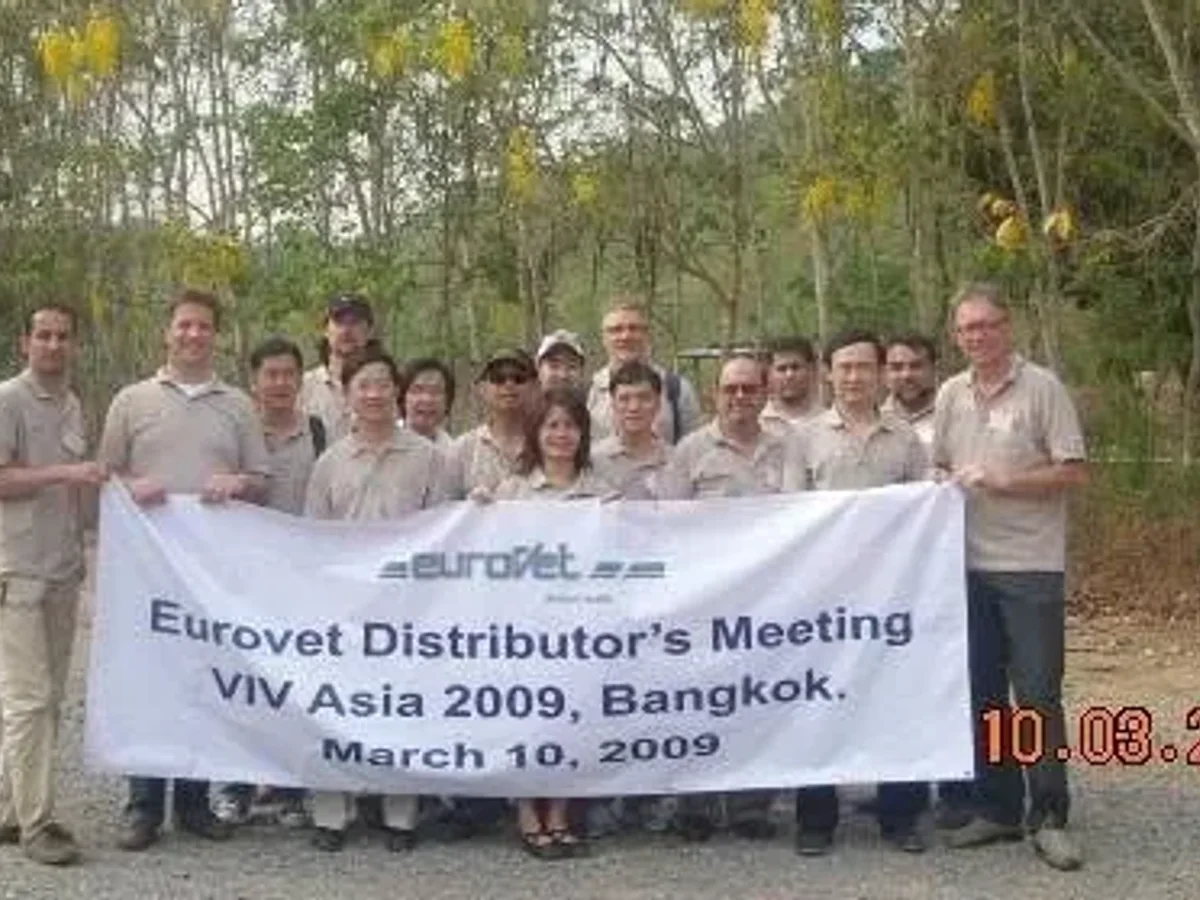 Group holding an Eurovet Distributor's Meeting banner at VIV Asia 2009 in Bangkok